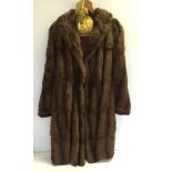 A vintage fur coat 3/4 length with label from Brahams, Norwich & London.