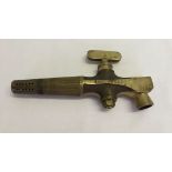 A brass beer barrel spigot. Top stamped "The Racco by Gestelle & Chambers Ltd".