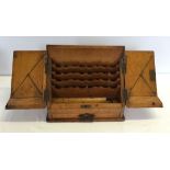 A vintage wooden slope fronted stationary box.