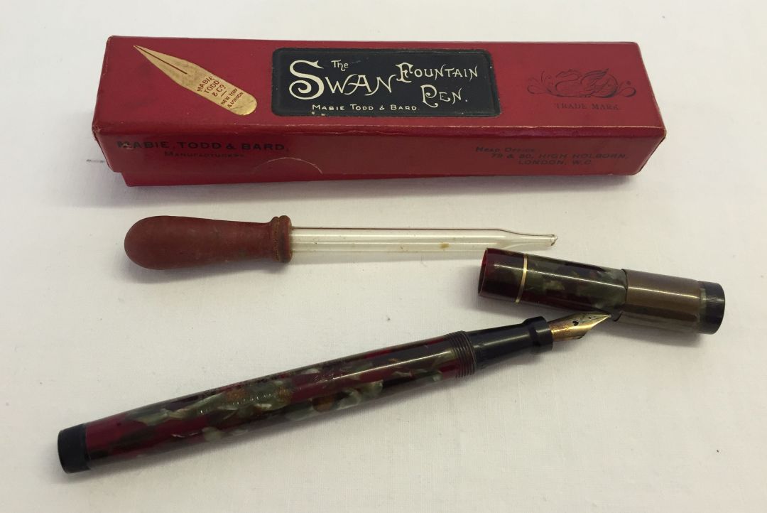 A boxed 'The Swan' fountain pen by Mabie Todd & Bard with 14ct gold nib. Complete with