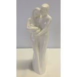 'Moments' by Coalport series figurine entitled 'The Gift of Love' depicting parents holding a new