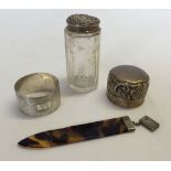 4 silver items comprising a silver topped bottle, a napkin ring, a bottle top & a faux tortoiseshell