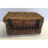 A small wicker hamper.