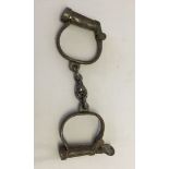 A pair of vintage Hiatt handcuffs.