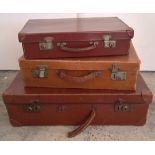 3 vintage suitcases of different sizes.