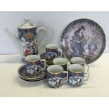 An oriental style coffee set of blue and white colouration. Comprising 6 cup and saucers and a