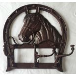 A cast iron modern horse show shaped coat hook rack.