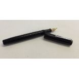 A 'Jackdaw' self filling pen by Mabie Todd & Co with 14ct gold nib.