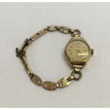 9ct gold cased Swiss Hirco ladies watch with a gold plated bracelet strap.