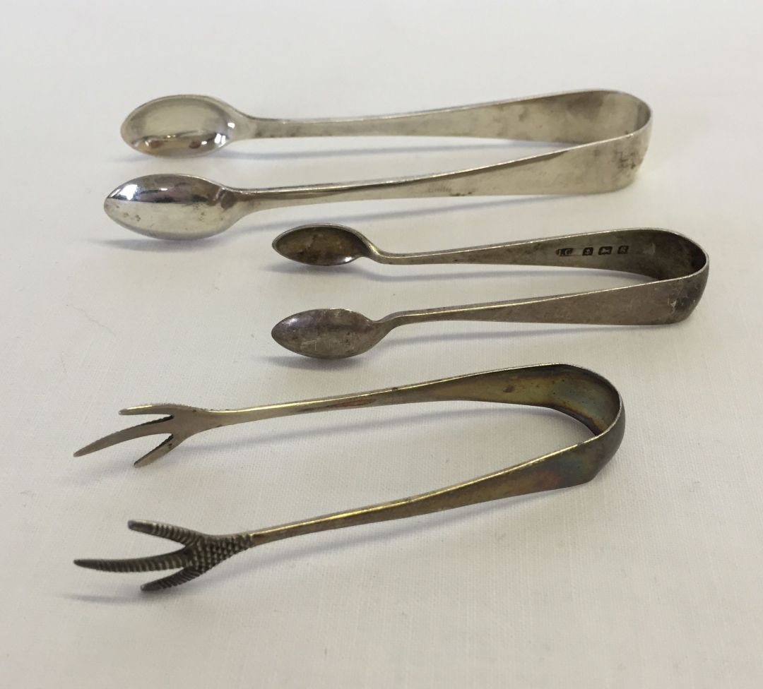 3 pairs of HM silver sugar tongs, one pair with claw feet. Total weight approx 48.3g.