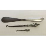 Antique silver handled shoehorn with a large boot hook with art nouveau design silver handle and a