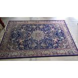 Large wool carpet/rug with a Middle Eastern hunting scene in blue, cream and pink colours. Approx 3m