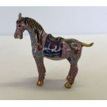 A Small cloisonne horse of pink, blue and green colour. Approx 7cm high.