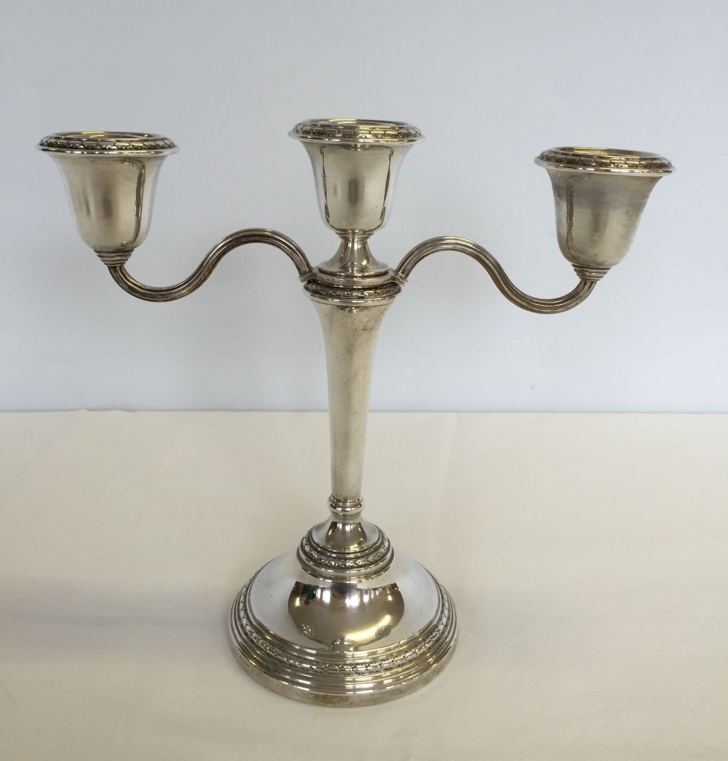 A hallmarked silver candleabra. Approx 8"/20cm tall x 9"/23cm across. Maker Elkington & Co.