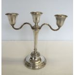 A hallmarked silver candleabra. Approx 8"/20cm tall x 9"/23cm across. Maker Elkington & Co.