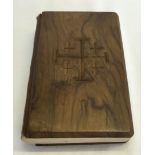 An original military issued wooden bible with wooden back & front, made by POW.