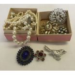 A collection of costume jewellery to include a Sarah Coventry bird brooch.