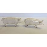 2 white Beswick pigs. Wall Queen 40 and a matte/unglazed boar.