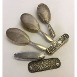 A collection of 5 antique silver back and handled brushes, plus one back panel.