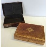 A small vintage leather suitcase together with a leather stationary box.