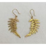 A pair of gold drop earrings with fern design. Tests as 14ct gold, approx weight 3.2g.