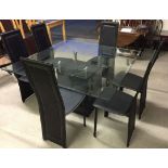 A modern design glass top dining table with a black marble design base together with 6 faux