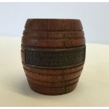 A turned miniature wooden barrel made from the teak of HMS Iron Duke Admiral Jellicoe's flag ship at