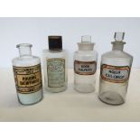 4 vintage glass chemists jars to include 2 French examples.