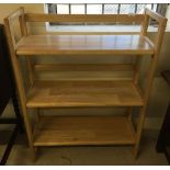 A pine fold away shelf unit from John Lewis. When open 37" tall x 28" wide x 11.5" deep approx.