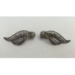 A pair of silver and marcasite clip on earrings.