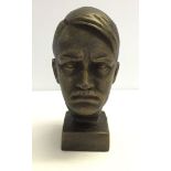 A reproduction cast iron figure of Adolf Hitlers head. 20cm tall.