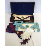 A Masonic leather case with apron and accessories.