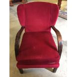 A red upholstered vintage armchair.