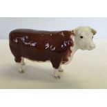 A Beswick Hereford Cow, champions of champions in brown & white gloss finish model #1360.