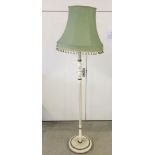 A white & gold painted standard lamp