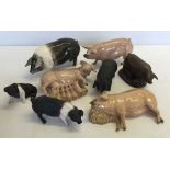 A selection of ceramic pigs to include 'The Charm of Creamware, Heredities, England' and 'Country