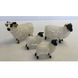 A Beswick Black Faced Ram (a/f leg had been repaired) together with a Beswick Black faced Ewe & 2