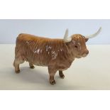 A ceramic Beswick Highland Cow in tan brown gloss finish. Issued 1961-1990. Model #1740.