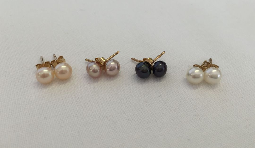 4 pairs of 10K gold & pearl earrings.