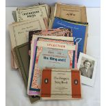 A box of vintage sheet music.