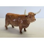 A Beswick Highland Cow figurine in tan brown gloss finish. Model #1740. Issued 1961-1990.