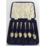 A boxed set of silver coffee spoons with decorative handles. HM Sheffield 1926. Maker Thomas