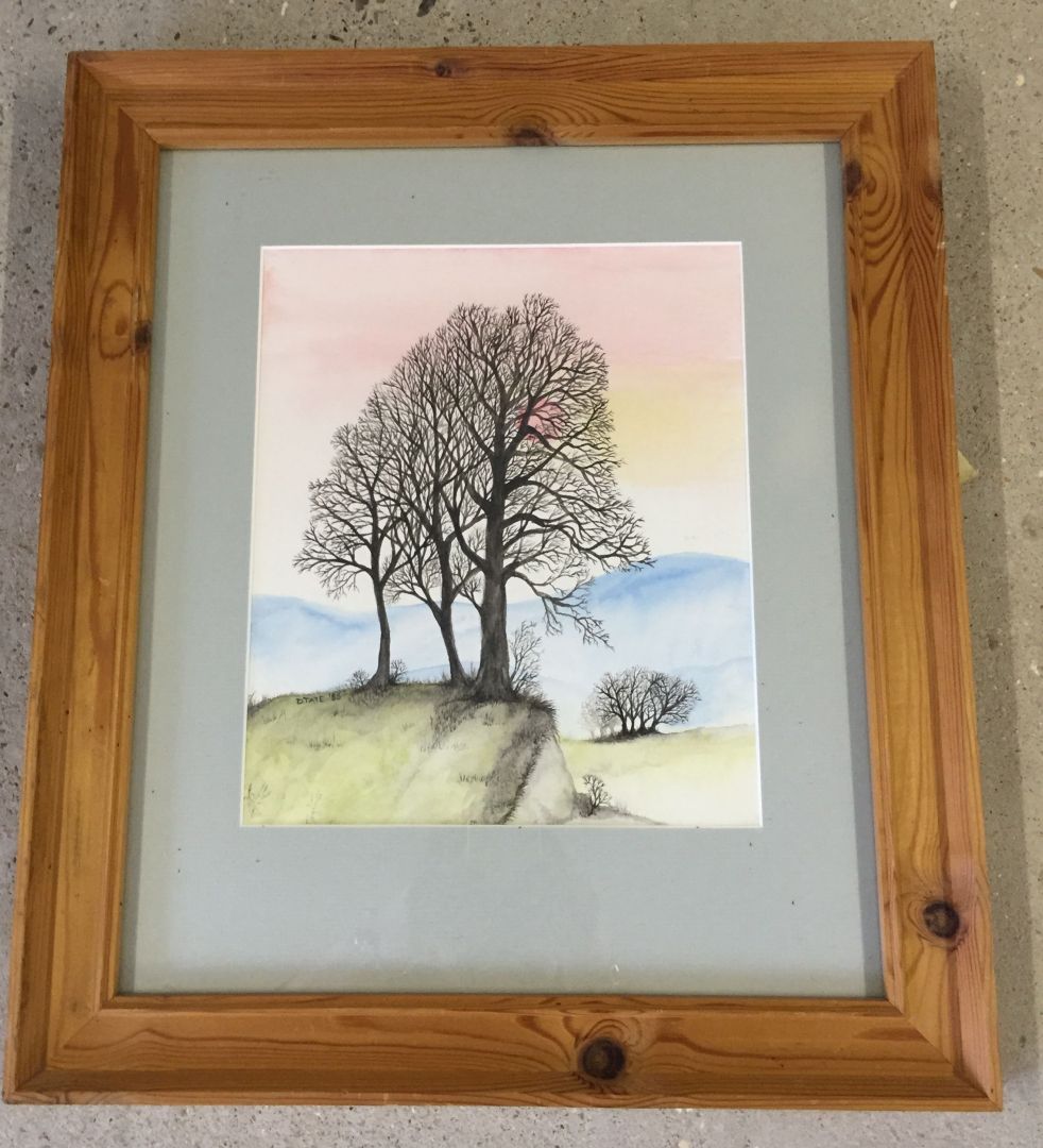 A framed and glazed watercolour of trees on a hill signed D Tate '83. Approx size 24.5 x 29cm