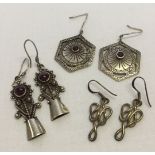 3 pairs of silver earrings, 2 set with garnets.