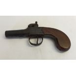 A small wooden handled pistol marked J & W Sherwood, London.