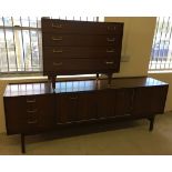 A G-Plan sideboard with concertina style cupboard doors together with a matching G Plan chest of