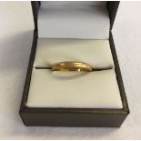 A 22ct gold wedding band. Total weight approx 3.1g. Size N1/2.