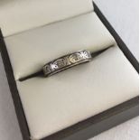 A 9ct gold, silver and diamond full eternity ring. Total weight approx 2.2g. Size J1/2.