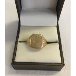 A 9ct gold gents signet ring etched with HR monogram. Total weight approx 4.6g. Size O.