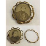 A Victorian mourning brooch with central rotating locket a/f.